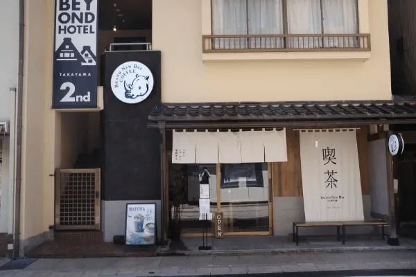 Quaint shop fronts decorated with blue fabric curtains